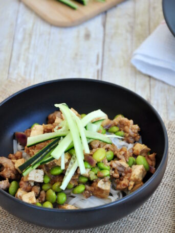 Hoisin noodles topped with a pan-fried sauce mixture featuring ground pork and edamame. It's quick, easy, and comforting.