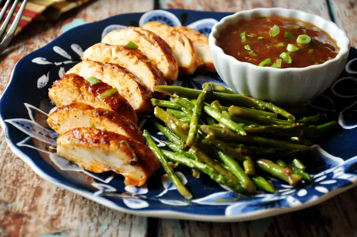 Baked Chicken In Spicy Peach Sauce With Sautéed Asparagus