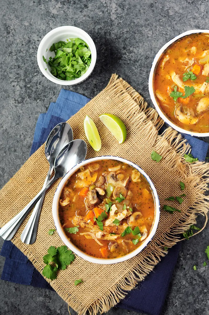 30-min chicken soup recipe loaded with vegetables. Add some noodles to transform it into a hearty chicken noodle soup. A slow cooker recipe is included. 