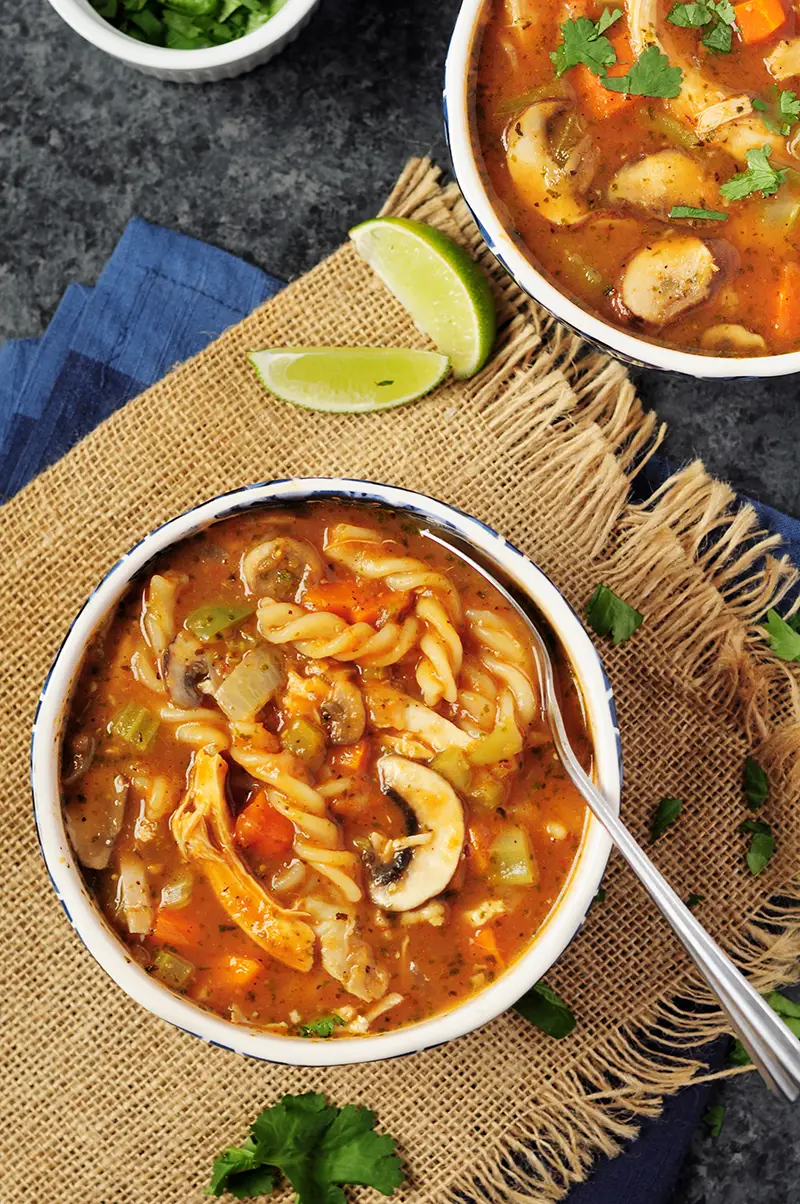 30-min chicken soup recipe loaded with vegetables. Add some noodles to transform it into a hearty chicken noodle soup. A slow cooker recipe is included. 