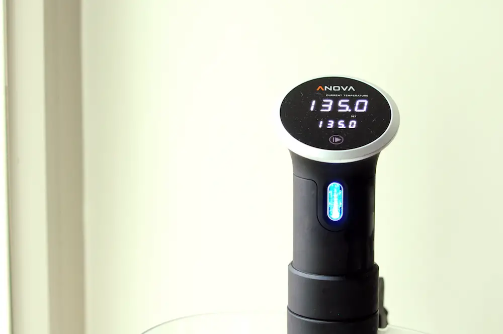 Anova sous vide machine set to 135°F