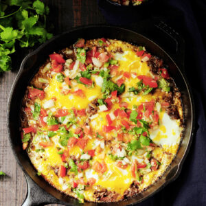 Baked eggs in barbacoa beef and topped with cheese, this is a perfect way to turn leftover barbacoa beef into an amazing brunch in just 20 minutes.