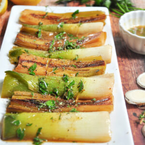 Leeks braised in butter, white wine, and chicken bone broth with fresh herbs and lemon juice. Absolutely unconventional, yet amazing!