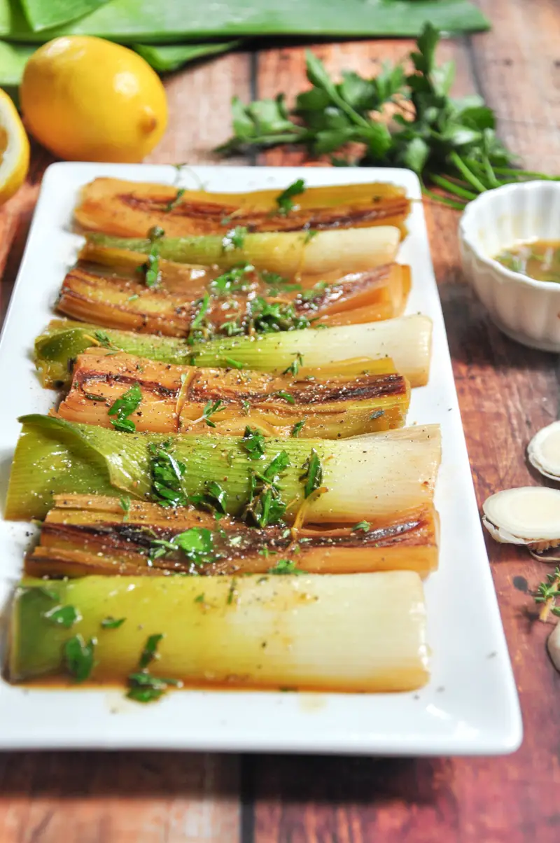 Leeks braised in butter, white wine, and chicken bone broth with fresh herbs and lemon juice. Absolutely unconventional, yet amazing!