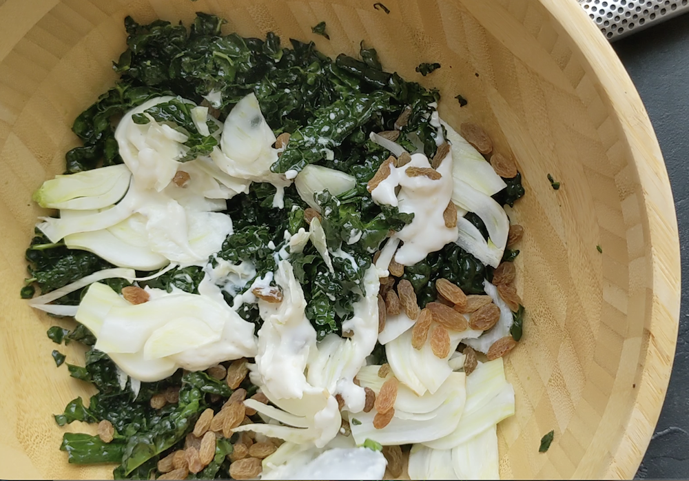 Build the salad: Scatter the thinly sliced fennel and raisins over the massaged kale. Pour the yogurt sauce over everything and toss with real enthusiasm until every leaf is coated. Fold in the Parmesan at the end so it stays in those satisfying, delicate shavings rather than clumping. 