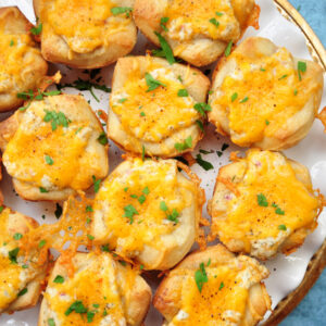 Cheese, crab, herbs and lemon, plus a pizza crust shaped into muffin cups, these cheesy crab appetizers are super fun and quick to make.