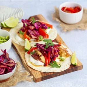 These quick Chicken Fajita Tacos come together in 30 minutes with a stovetop method or pre-cooked sous vide chicken for an even faster meal.