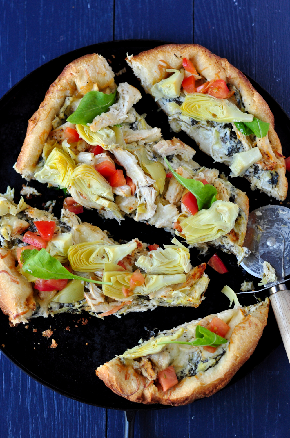 Slow cooker chicken Florentine pizza cut into slices  