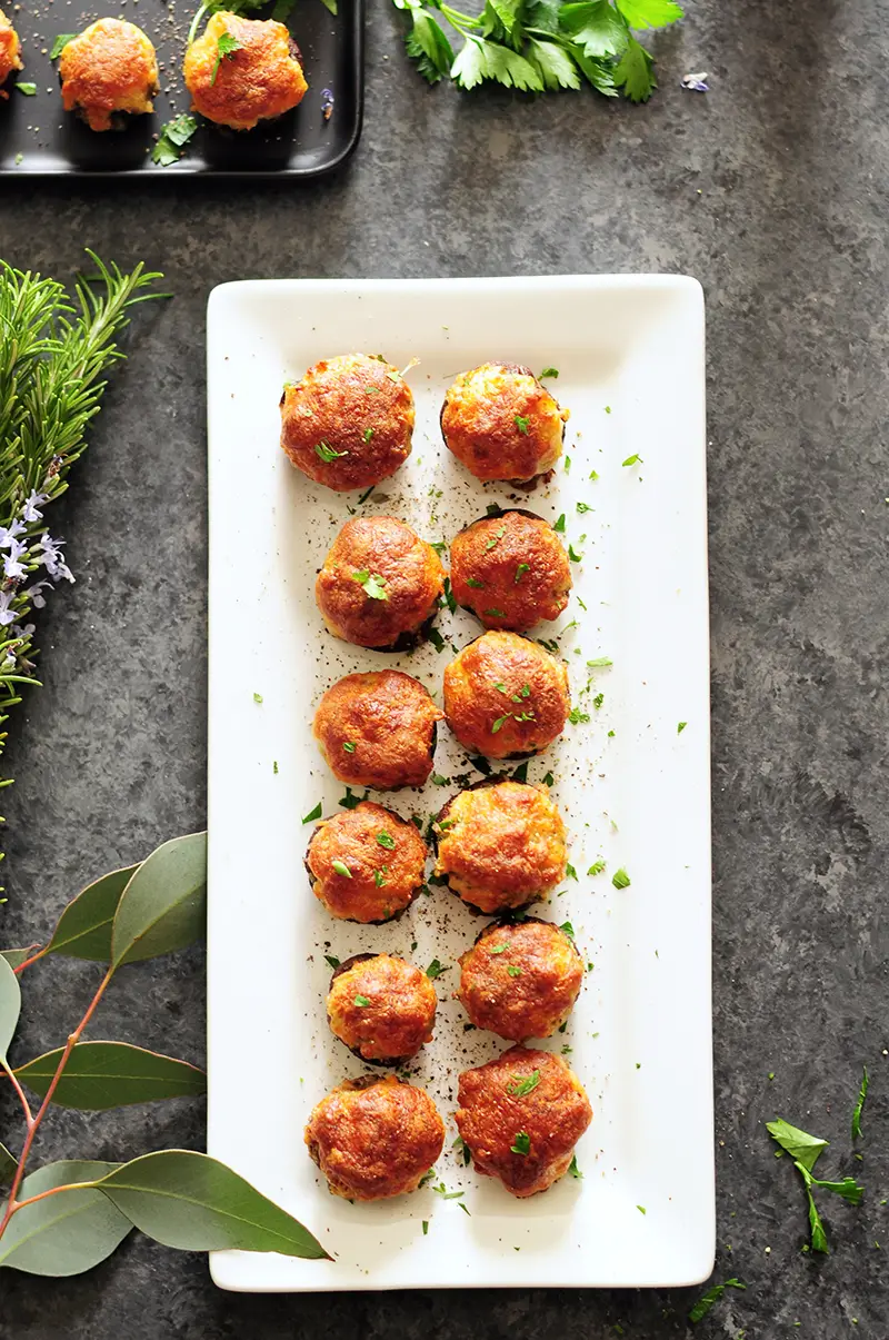 Gluten-free crab filling stuffed into mushrooms and covered with a blanket of cheese, these crab stuffed mushrooms are amazing for a crowd or just for you.