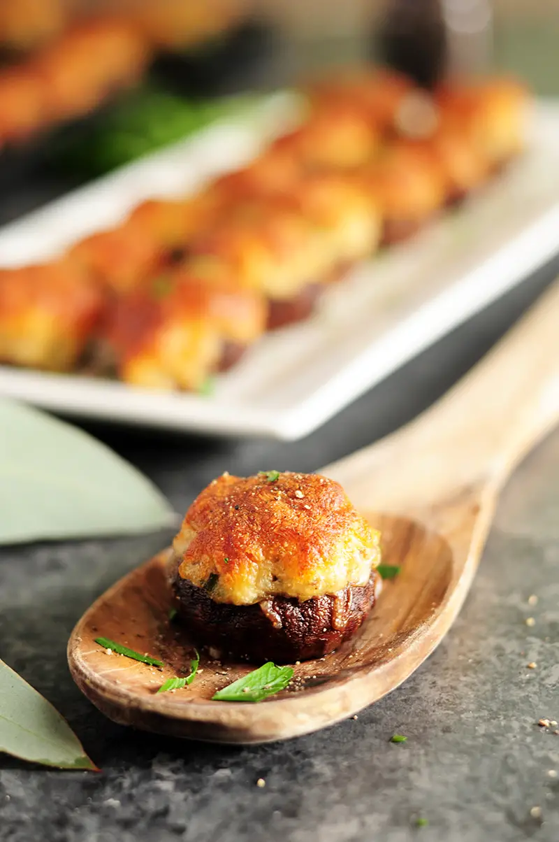 Gluten-free crab filling stuffed into mushrooms and covered with a blanket of cheese, these crab stuffed mushrooms are amazing for a crowd or just for you.