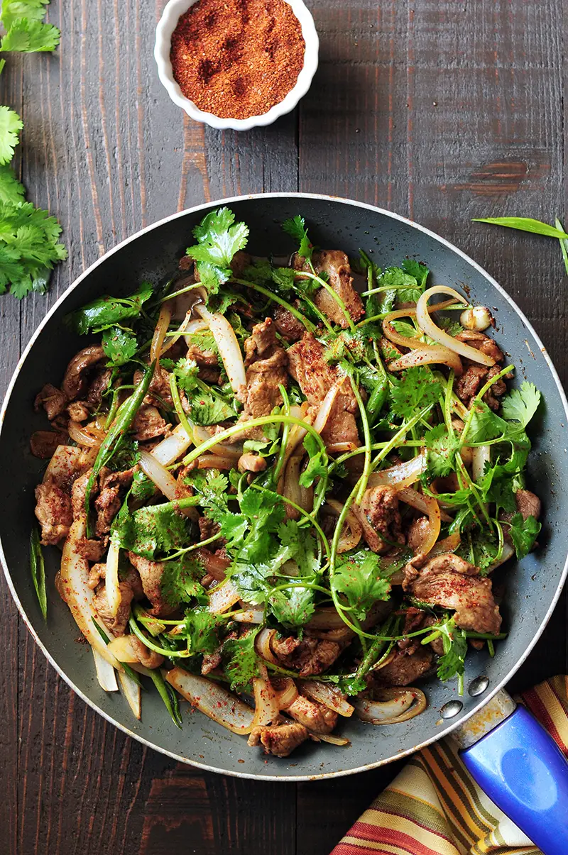 This authentic Chinese cumin lamb recipe takes less than 30 minutes to put together. It might just become your go-to lamb recipe after you try it.