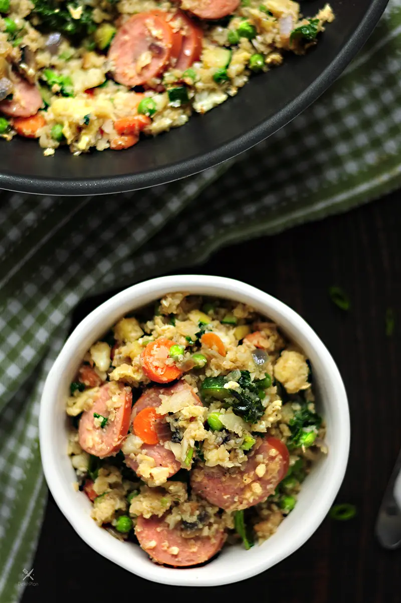 Cauliflower rice fried w/ loads of veggies & kielbasa in a tasty gluten-free sauce. It’s a savory low-carb meal you can make for your family in 30 minutes.