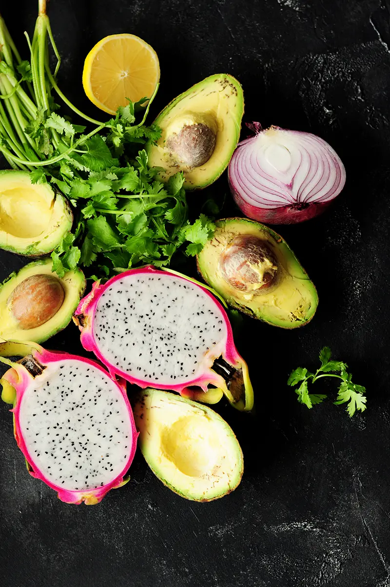 Surprise and delight your taste buds by combining dragon fruit with creamy avocado for a refreshing guacamole served individually in a dragon fruit shell.