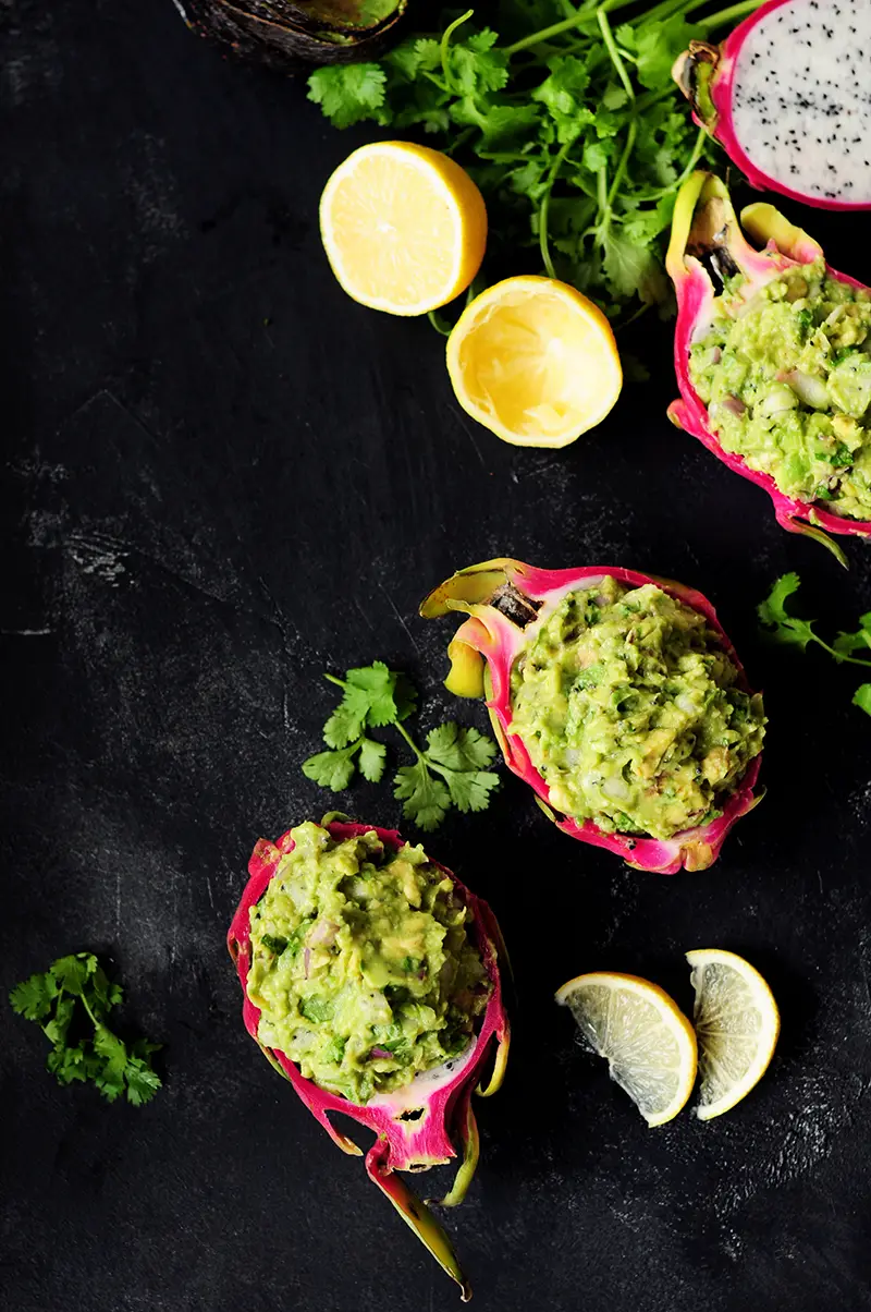 Surprise and delight your taste buds by combining dragon fruit with creamy avocado for a refreshing guacamole served individually in a dragon fruit shell.