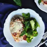 This baked chicken parmesan without breading is an easy meal to put together for a cozy weeknight dinner. It's so much healthier than frying!