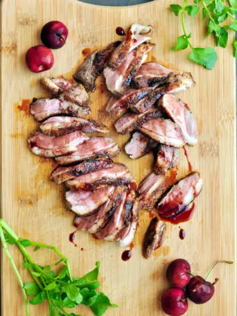 Perfect sous vide duck breast seasoned with fragrant five-spice with ginger and garlic, then served with a luscious and tangy cherry sauce.