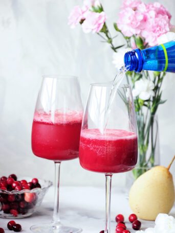 This fresh pear and cranberry mocktail is healthy, full of flavor, and lower in sugar than most fruity drinks. Perfect for the holidays or girls’ nights in.