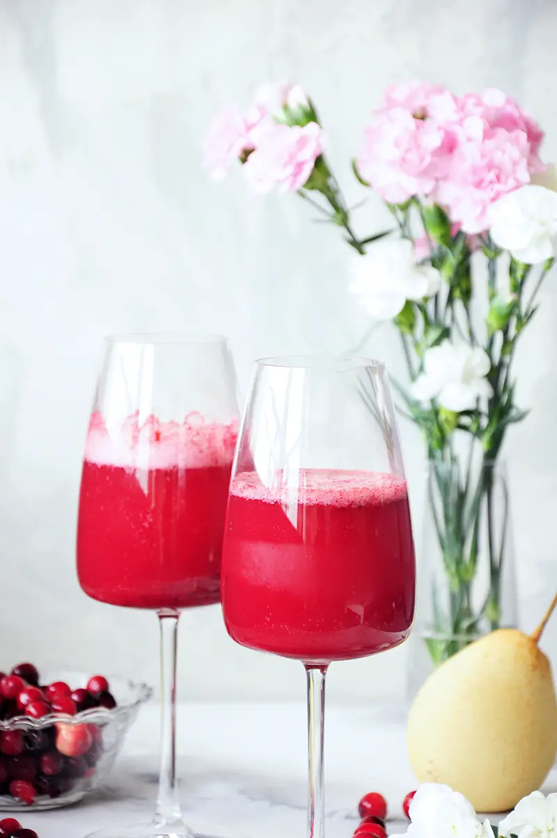 This fresh pear and cranberry mocktail is healthy, full of flavor, and lower in sugar than most fruity drinks. Perfect for the holidays or girls’ nights in.