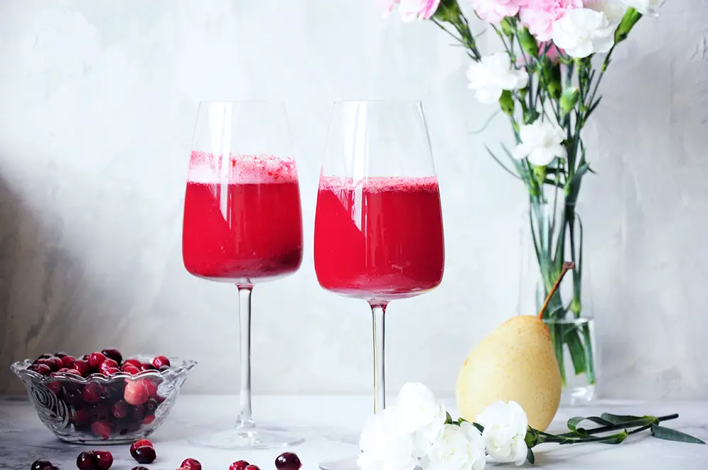 This fresh pear and cranberry mocktail is healthy, full of flavor, and lower in sugar than most fruity drinks. Perfect for the holidays or girls’ nights in.