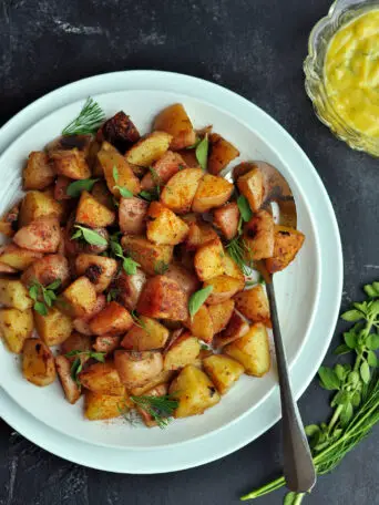 Crispy-skinned sous vide potatoes cooked with garlic-infused oil and smoked paprika. In the unlikely event that you have leftovers, think potato salad.