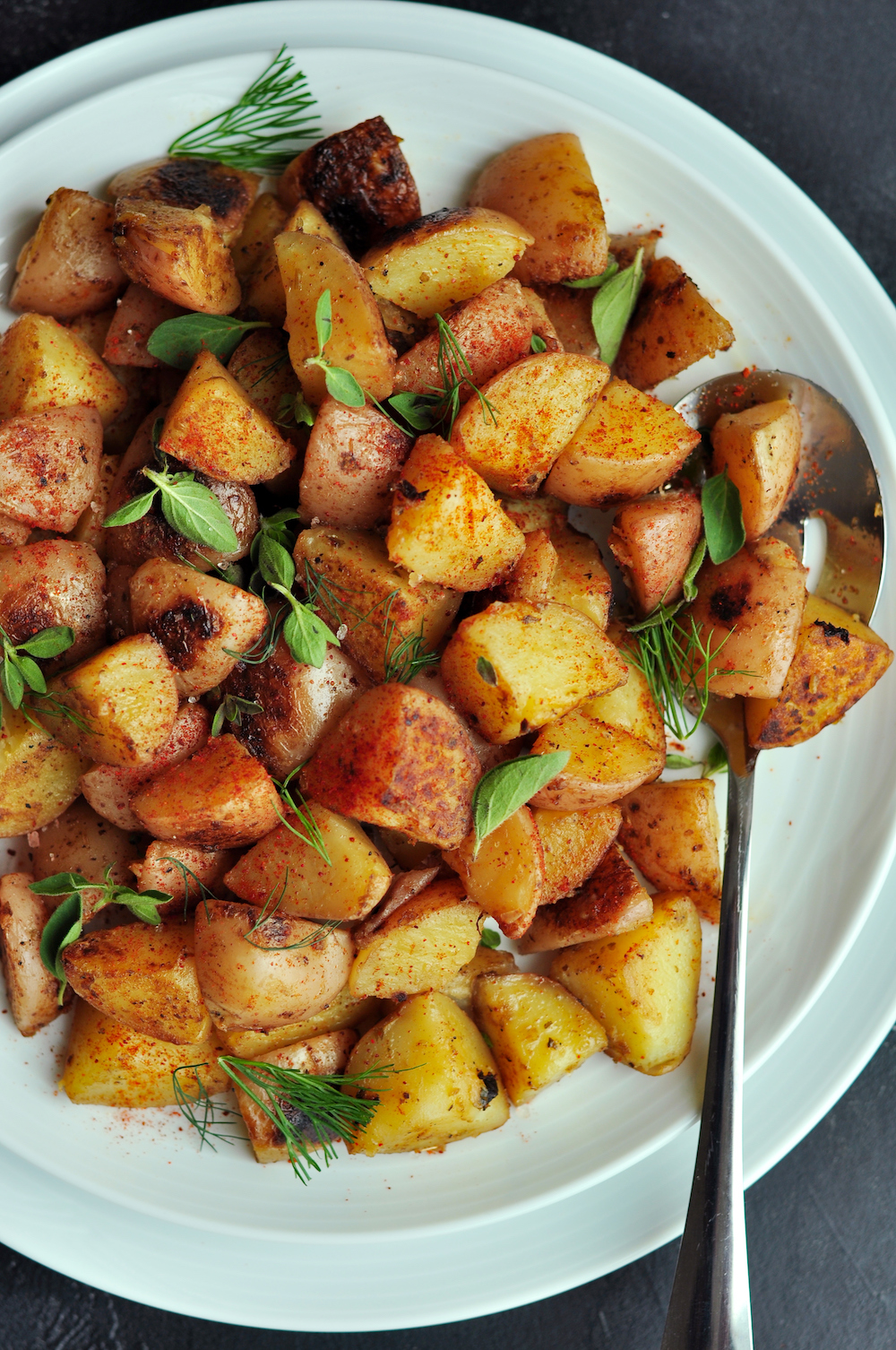 Crispy-skinned sous vide potatoes cooked with garlic-infused oil and smoked paprika. In the unlikely event that you have leftovers, think potato salad.