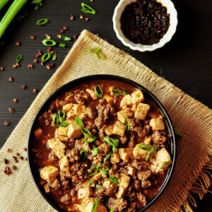 Traditional Mapo Tofu made easy and gluten-free with homemade hot chili oil and pepper solids, then simmered in hearty bone broth!