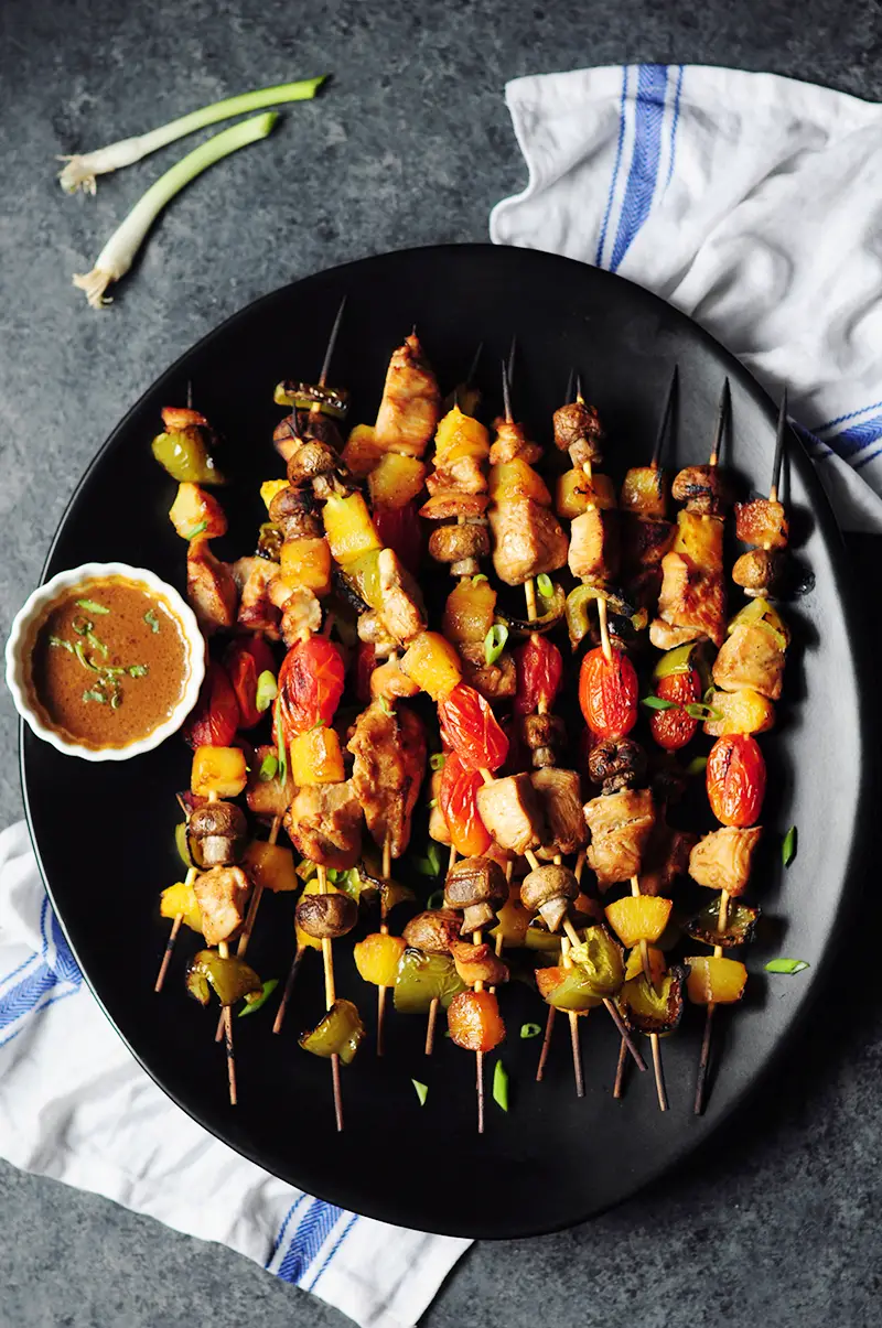 Chicken kabobs with marinated chicken, bell peppers, pineapple chunks, mushrooms and cherry tomatoes are packed with flavor and perfect for your gatherings.