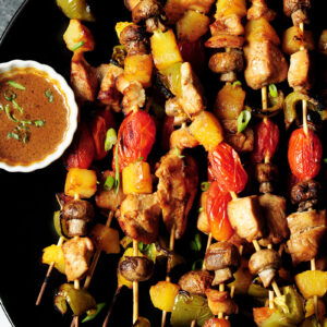 Chicken kabobs with marinated chicken, bell peppers, pineapple chunks, mushrooms and cherry tomatoes are packed with flavor and perfect for your gatherings.