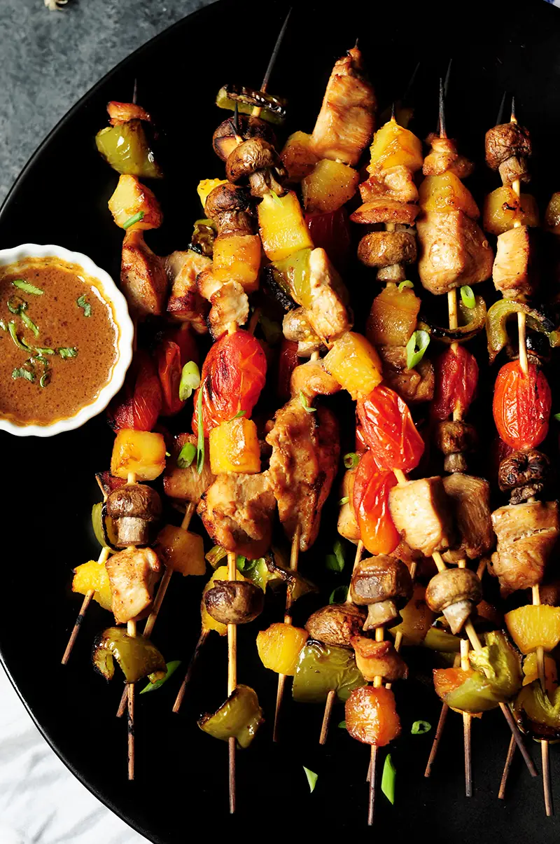 Chicken kabobs with marinated chicken, bell peppers, pineapple chunks, mushrooms and cherry tomatoes are packed with flavor and perfect for your gatherings.