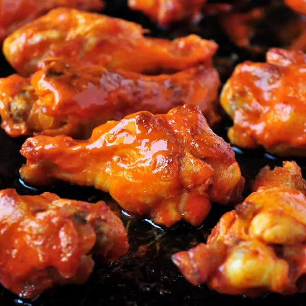 These buffalo-style grilled chicken wings take 20 minutes on the grill and they are finger lickin' good! You can also broil them in the oven.