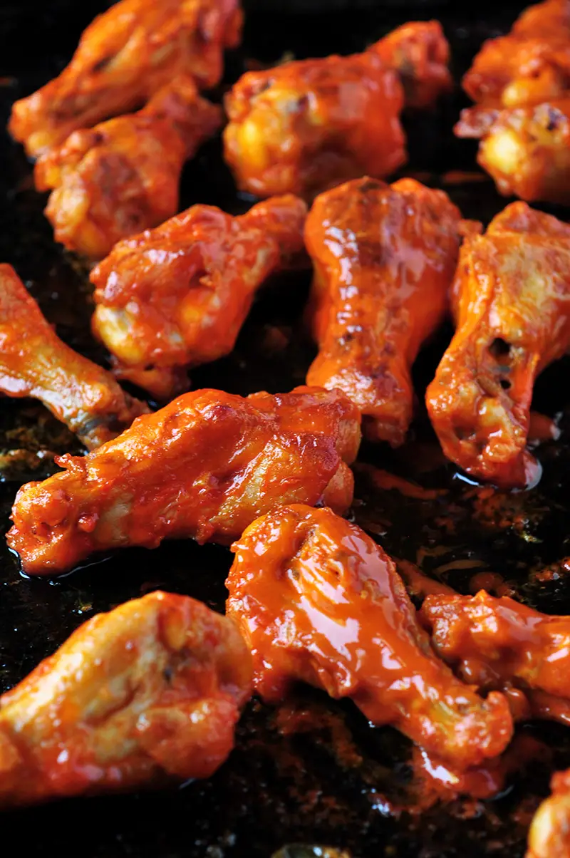 These buffalo-style grilled chicken wings take 20 minutes on the grill and they are finger lickin' good! You can also broil them in the oven.