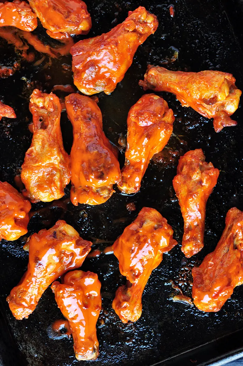 These buffalo-style grilled chicken wings take 20 minutes on the grill and they are finger lickin' good! You can also broil them in the oven.