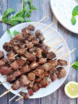 Grilled lamb kabobs served with creamy tzatziki bring Mediterranean magic to your table in 40 minutes or less! It's perfect for easy weeknights or lively gatherings.