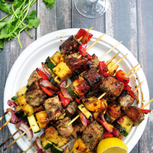 Grilled tuna, red onions, bell peppers, pineapples and zucchini on skewers, these tuna kabobs are basted and served with an amazing pineapple glaze. Yum!