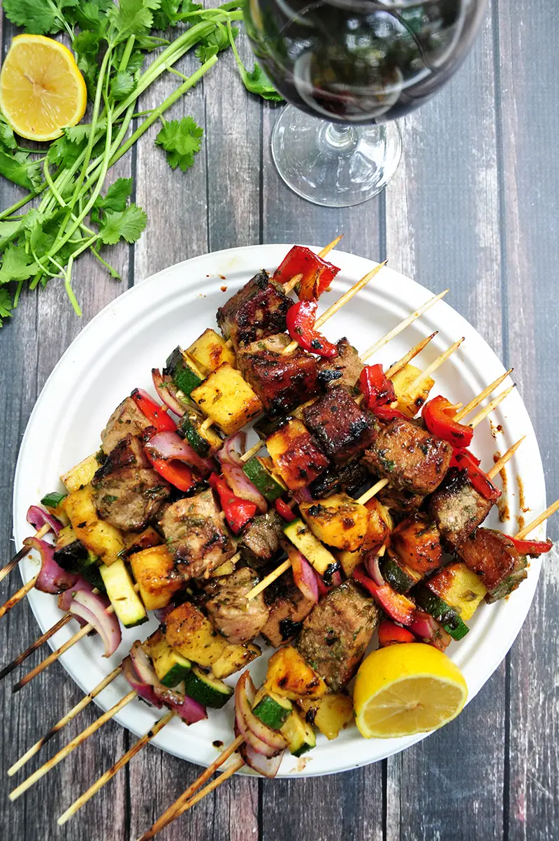 Grilled tuna, red onions, bell peppers, pineapples and zucchini on skewers, these tuna kabobs are basted and served with an amazing pineapple glaze. Yum!