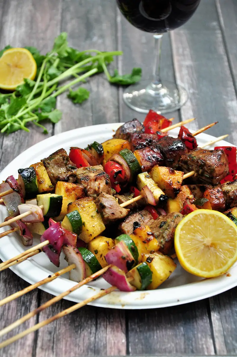 Grilled tuna, red onions, bell peppers, pineapples and zucchini on skewers, these tuna kabobs are basted and served with an amazing pineapple glaze. Yum!