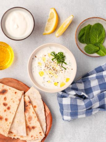 This homemade tzatziki sauce is creamy, refreshing, and ready in 5 minutes! It's perfect for dips, gyros, and salads. Gluten-free + low-carb!