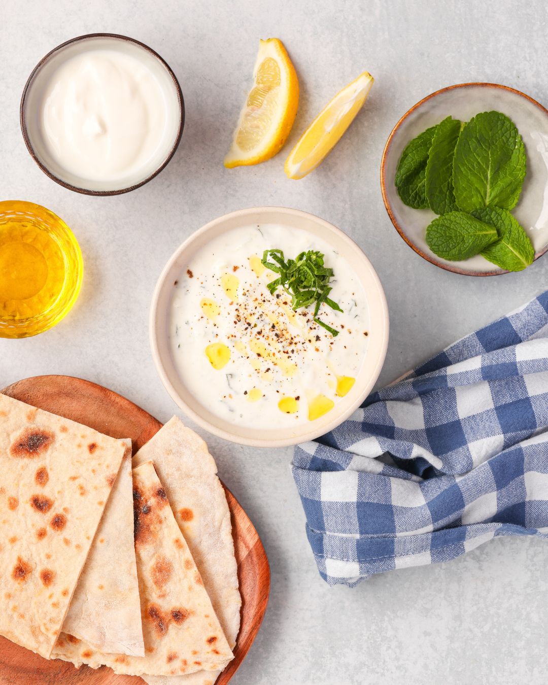 This homemade tzatziki sauce is creamy, refreshing, and ready in 5 minutes! It's perfect for dips, gyros, and salads. Gluten-free + low-carb!