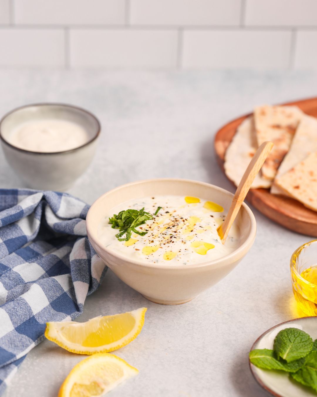 This homemade tzatziki sauce is creamy, refreshing, and ready in 5 minutes! It's perfect for dips, gyros, and salads. Gluten-free + low-carb!