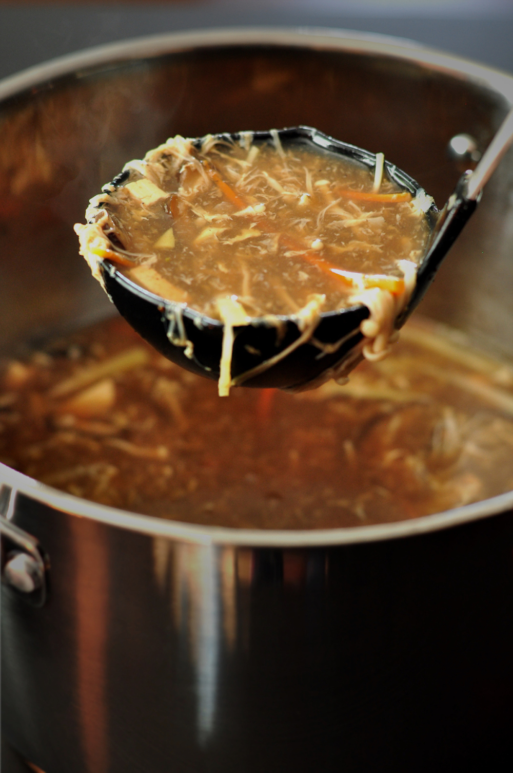 Ladling hot and sour soup