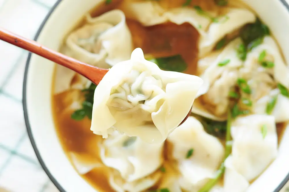 A step-by-step guide to homemade wonton soup, one of the heartiest Chinese comfort foods. It’s also a fantastic, healthy freezer meal for a whole family.