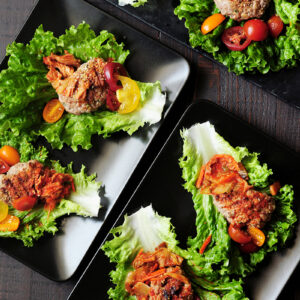 Easy lettuce wraps featuring grilled ground beef patties and kimchi. It takes less than 30 minutes to put this delicious Korean-style appetizer on the table.