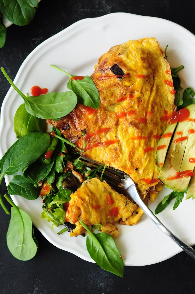 Start your day right with this 10-min gluten-free breakfast omelette! It’s loaded w/ vegetables, cheese, & your preferred meat. It's super healthy & delish.