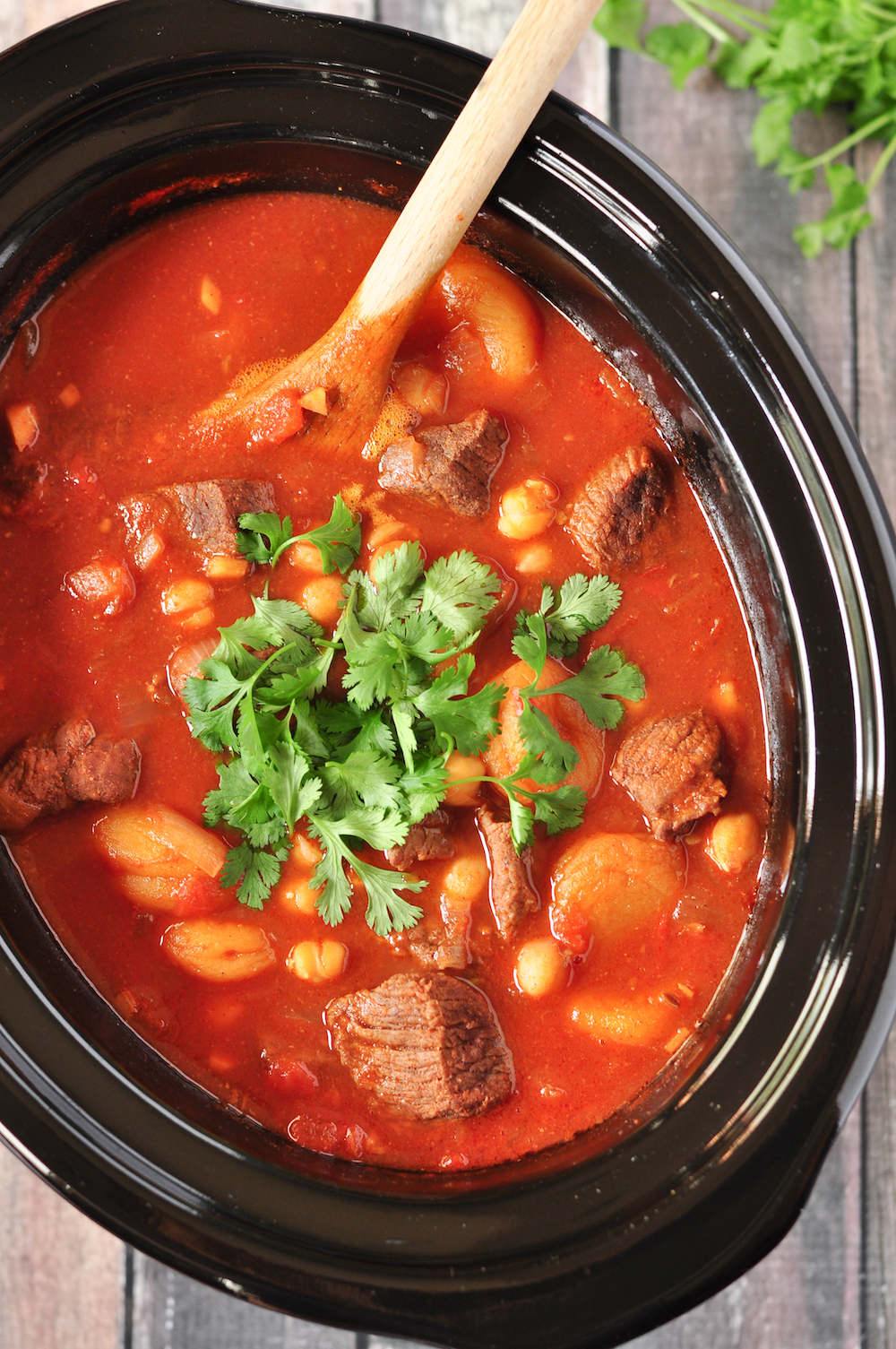 This gluten-free Moroccan lamb stew is made in 5 easy steps, and the slow cooker does the rest. Loaded with authentic spices and flavors. 