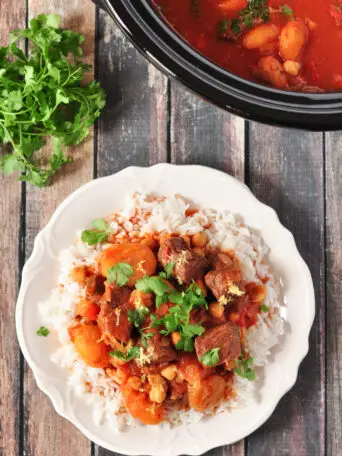 This gluten-free Moroccan lamb stew is made in 5 easy steps, and the slow cooker does the rest. Loaded with authentic spices and flavors.