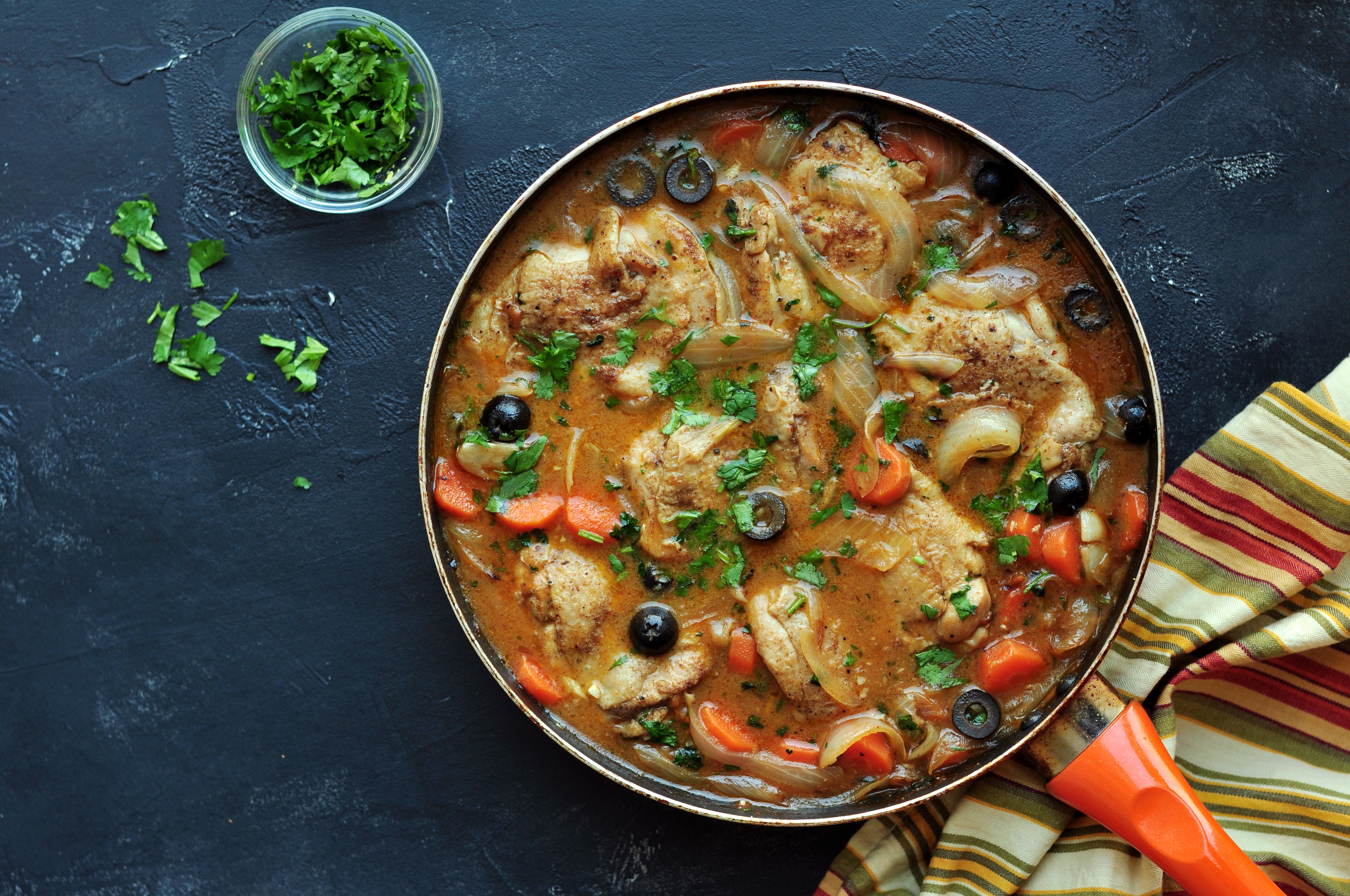 Bring the chicken tagine together by nesting the sous vide chicken into the tagine base along with its juice from the cooking bag.