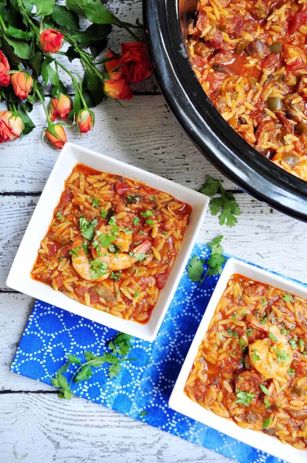 Dished one-pot jambalaya pasta featuring, Andouille sausage, chicken, shrimp, loads of veggies, and oval-shaped orzo pasta.