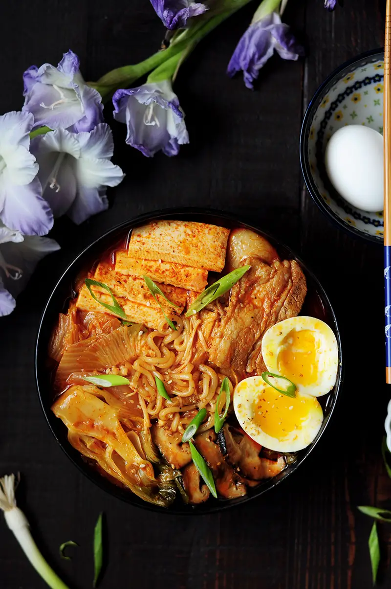 This epic kimchi ramen features pork belly, shiitake mushrooms, bok choy, tofu, and kimchi! The best part is that it's one pot and only takes 30 minutes!