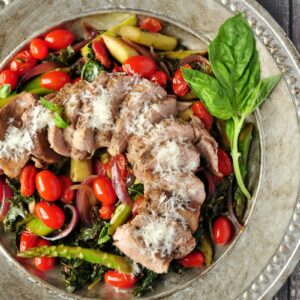 Pork over Warm Kale and Asparagus Salad