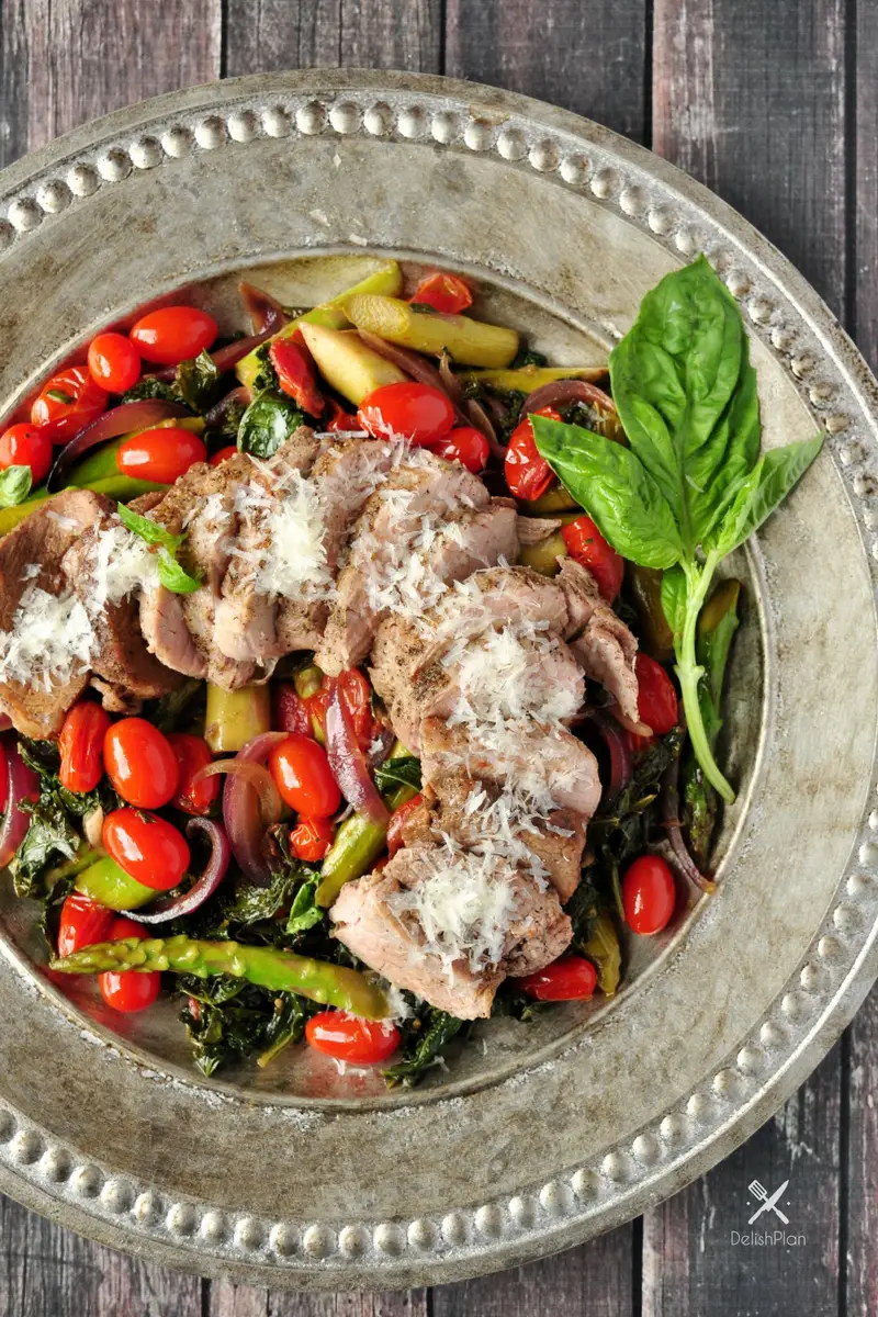 Pork over Warm Kale and Asparagus Salad